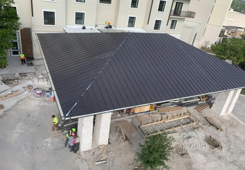 Metal roofing installation team working on a commercial building in Oregon